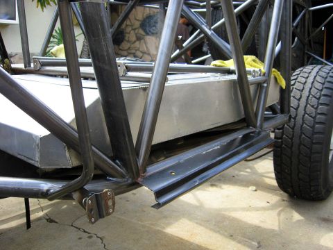 1995 Ford Bronco - The custom chassis of an off-road vehicle is shown, a large fuel tank and a tire.