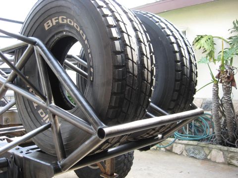 1995 Ford Bronco - Spare tires are mounted on a custom roll cage, ready for off-road use.