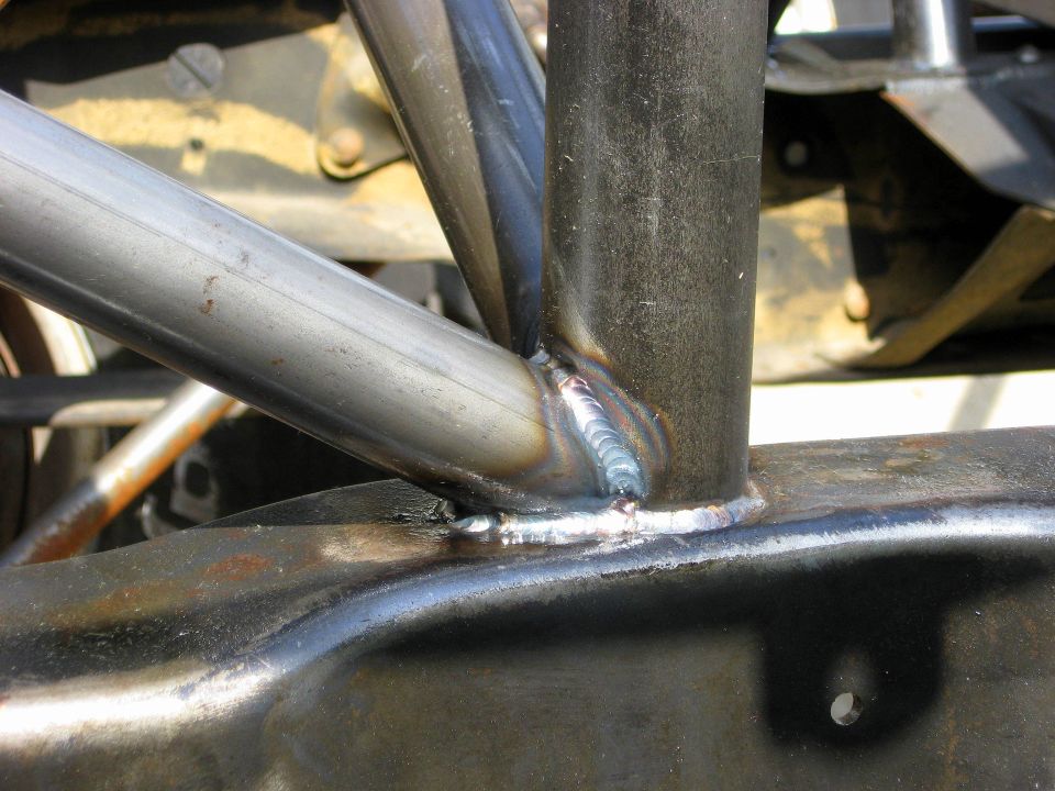 Close-up of welded metal tubing, part of a roll cage structure