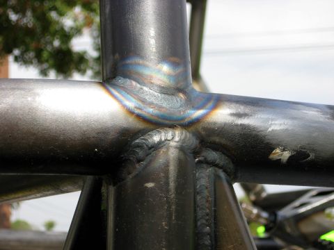 1995 Ford Bronco - Close-up view of welded metal tubing, showing heat discoloration and texture.
