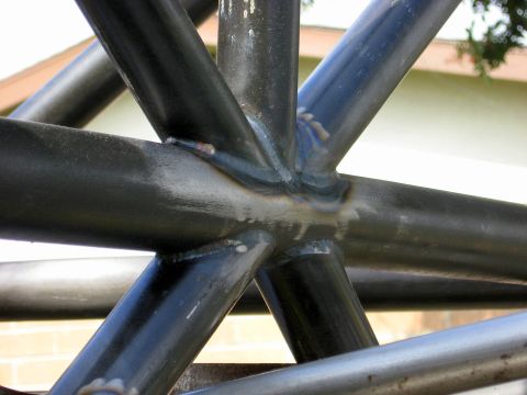 1995 Ford Bronco - Close-up of a welded roll cage structure, the "SUPERMOTORS.NET" watermark.