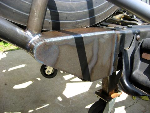 1995 Ford Bronco - Close-up view of custom roll cage fabrication, showing welded joints and a spare tire.