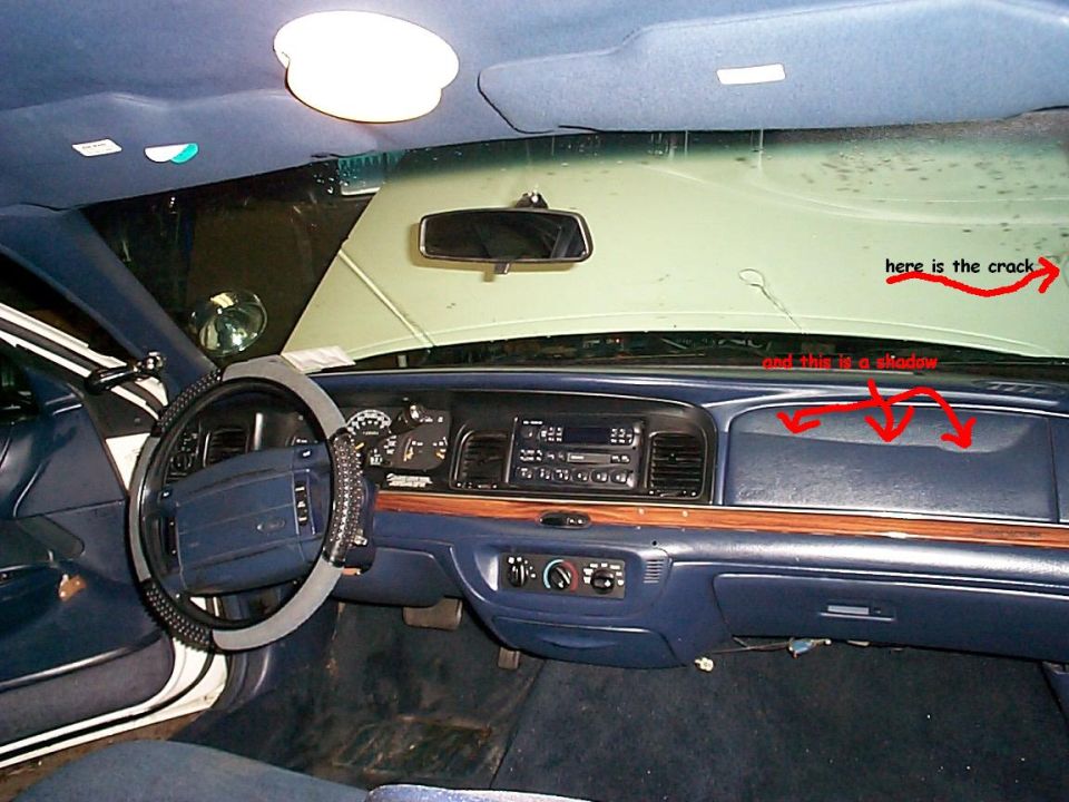 an interior shot, the line across the dash and windshield are a reflection, there is no crack in the dash or anything, and the windshield crack isnt visible in the pic, its way off to the right.