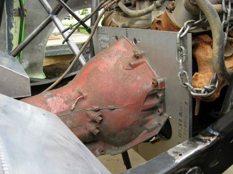 1995 Ford Bronco - Close-up view of engine and transmission components, with visible text on a metal plate.