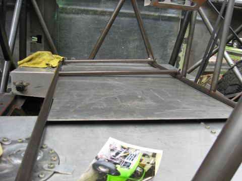 1995 Ford Bronco - Custom off-road vehicle interior shows a photo of a green buggy on the floor.