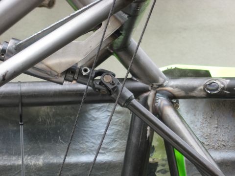 1995 Ford Bronco - The image shows a close-up view of the metal frame and a driveshaft component of a custom-built vehicle.