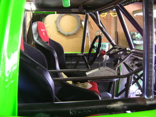 1995 Ford Bronco - This custom buggy features racing seats, a roll cage, and a shifter, suggesting it's built for off-road racing.
