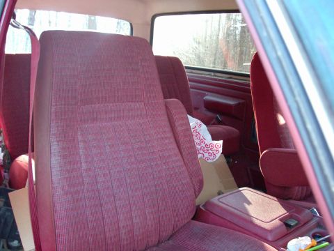 1988 Ford Bronco - Interior view of a 1988 Ford Bronco, highlighting the red upholstery and dashboard details.