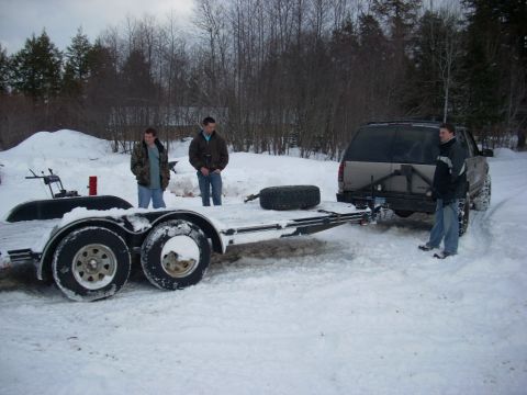 2000 Chevrolet Tahoe - A 2000 Chevrolet Tahoe is seen hitched to a trailer in a snowy environment with two men present.