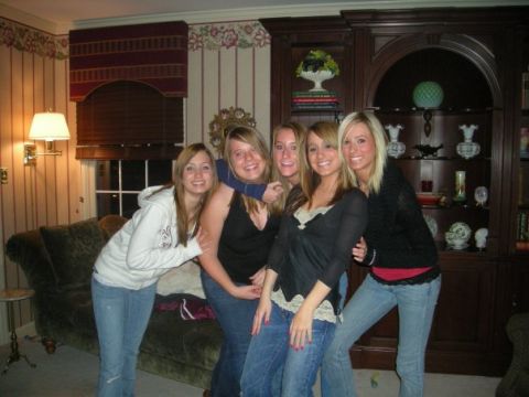 1989 Ford Bronco - A group of five young women pose for a picture in a living room setting, with a couch and a large bookshelf visible.