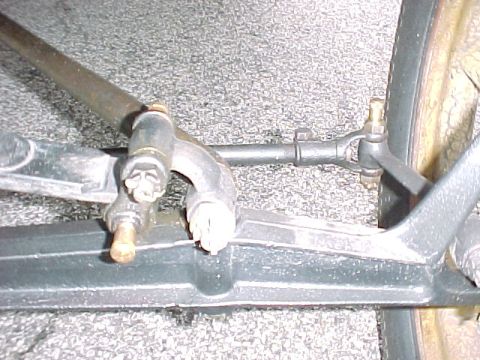 1913 Ford Model T - Steering tie rod has fine thread adjustment on drivers side with clamp bolt vertical to the ground.
