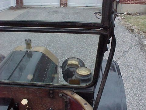 1913 Ford Model T - View from inside a 1913 Ford Model T, showing the dashboard and windshield structure.