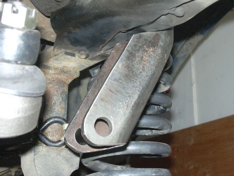 1991 Ford Bronco - Custom suspension bracket modification shown attached to a coil spring, likely for off-road use.