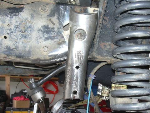 1991 Ford Bronco - track bar mount tack welded in place, notice the hole I had to drill to access the steering box bolt