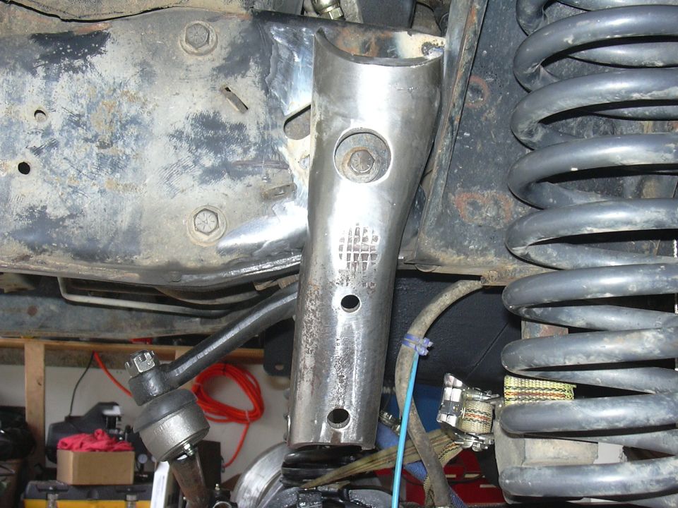 track bar mount tack welded in place, notice the hole I had to drill to access the steering box bolt