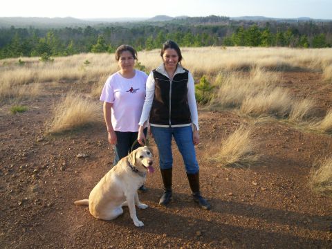 1993 Ford Bronco - A scenic outdoor view with two women and their dog enjoying the landscape.