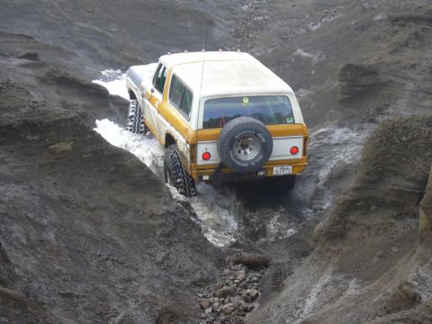 1991 Ford Bronco - This Ford Bronco navigates a challenging off-road terrain, its capabilities.