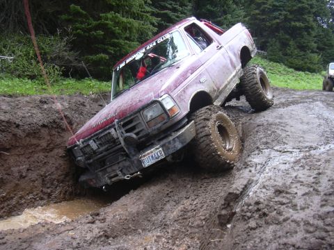 1991 Ford Bronco - This 1991 Ford Bronco is navigating a challenging muddy off-road course.
