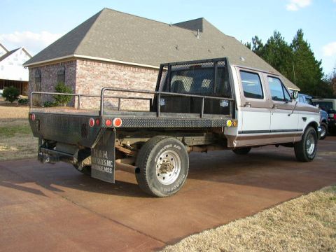 1995 Ford Bronco - This 1997 Ford F-350 Super Duty crew cab flatbed truck is seen from the rear passenger side.