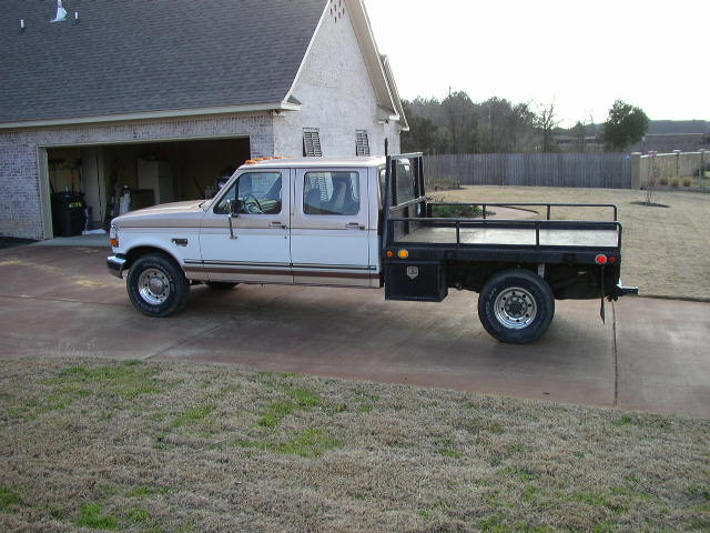 1995 Ford F-350 Super Duty flatbed truck parked in driveway