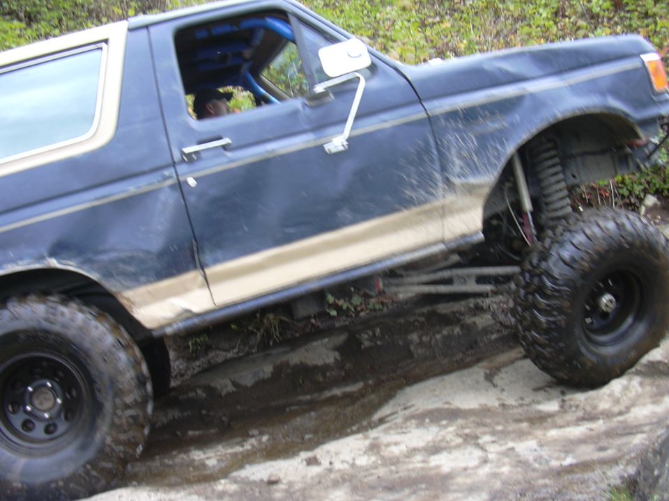 1991 Ford Bronco side view with lifted suspension and large tires