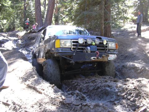 1991 Ford Bronco - This 1991 Ford Bronco navigates a challenging muddy trail during an off-road event.