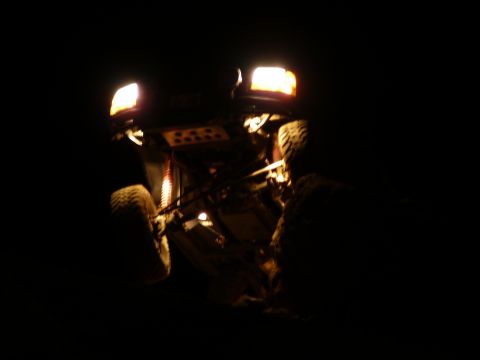 1991 Ford Bronco - This vehicle is seen at night with its headlights illuminated, revealing its undercarriage and tires.
