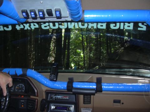 1991 Ford Bronco - Interior view of a 1991 Ford Bronco, modified with blue padding and additional switches.