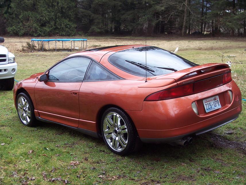 Orange 1995 Mitsubishi Eclipse coupe from rear-three-quarter view