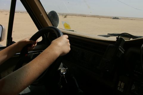 1986 Ford Bronco - Driving through a desert landscape from the perspective of the driver.