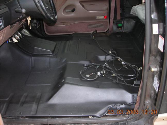 1993 Ford Bronco interior with exposed wiring and clean floor pan
