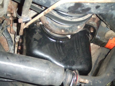 1996 Ford Bronco - Close-up view of engine oil pan and suspension components, with a watermark for Supermotors.net visible.