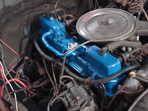 1979 Chevrolet C/K Pickup - The engine bay of a 1979 Chevrolet C/K Pickup shows blue valve covers and a chrome air cleaner assembly.