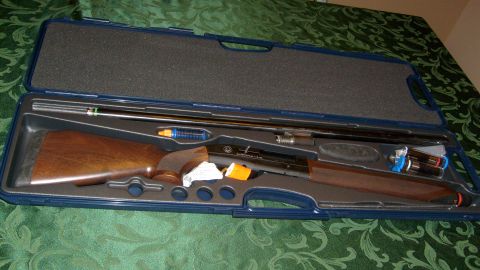 1995 Ford C-350 (Centurion Conversions) - Shotgun disassembled in its protective case, showing the stock, barrel, and cleaning accessories.