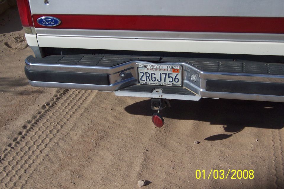 Rear of a white and red 1990 Ford Bronco with California plate 2RGJ756