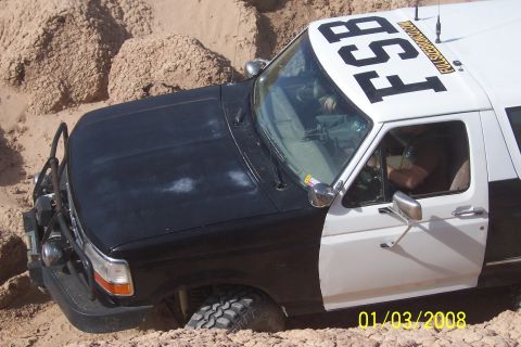 1990 Ford Bronco - This 1990 Ford Bronco, marked 'FSB', appears to be stuck in a sandy terrain.