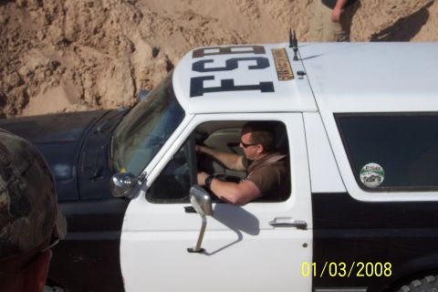 1990 Ford Bronco - Driver in a 1990 Ford Bronco, which has 'FSB' printed on its roof.