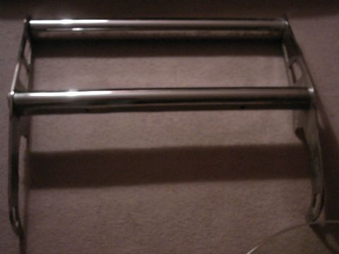 1987 Ford Bronco - A chrome bull bar is shown mounted on a vehicle, likely for an SUV or truck. The bull bar has two horizontal bars and vertical supports.