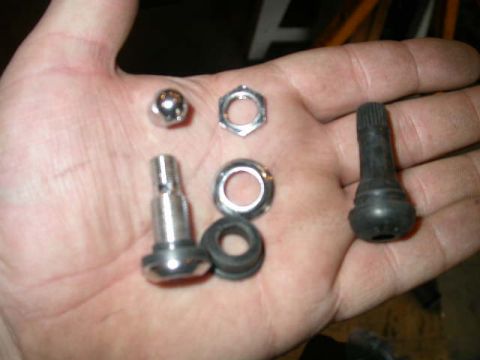 1990 Ford Bronco - Two different styles of civilian valve stems; the bolt on variety and the push in variety. I opted for the bolt on.