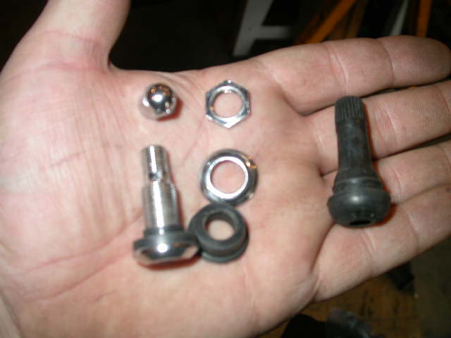 Two different styles of civilian valve stems; the bolt on variety and the push in variety.  I opted for the bolt on.