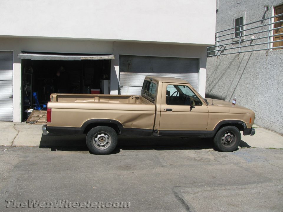 Side profile photo of a tan Ford Ranger pickup truck