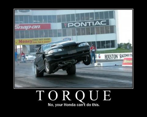 1992 Ford Mustang - Truck performing a wheelie, with the word TORQUE displayed.