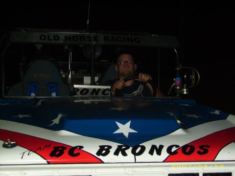 1978 Ford Bronco - A man drives a custom off-road vehicle with "BC BRONCOS" and "OLD HORSE RACING" text visible.