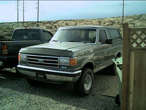 1989 Ford Bronco - This 1989 Ford Bronco is seen parked next to a pickup truck.