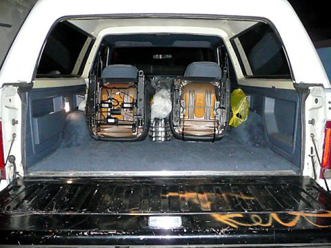 1991 Ford Bronco - The cargo area of a 1991 Ford Bronco is shown with the rear seats removed and placed inside.