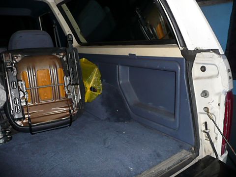 1991 Ford Bronco - The interior of a 1991 Ford Bronco shows the cargo area with a seat removed.