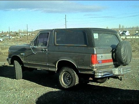 1989 Ford Bronco - This 1989 Ford Bronco is seen from the rear quarter angle, its spare tire mounted on the back.