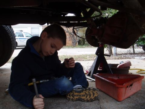 1980 Ford Bronco - Got a nut stuck in the socket, but thats ok, the 7 year old knows what to do and look how well he fits under the truck(4" lift w/35's).
