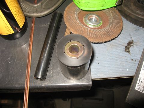 1990 Ford F-250 - Various automotive parts and tools are laid out on a workbench.