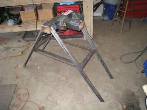 1996 Ford Bronco - A metal vise is secured to a custom metal stand, likely for workshop use.